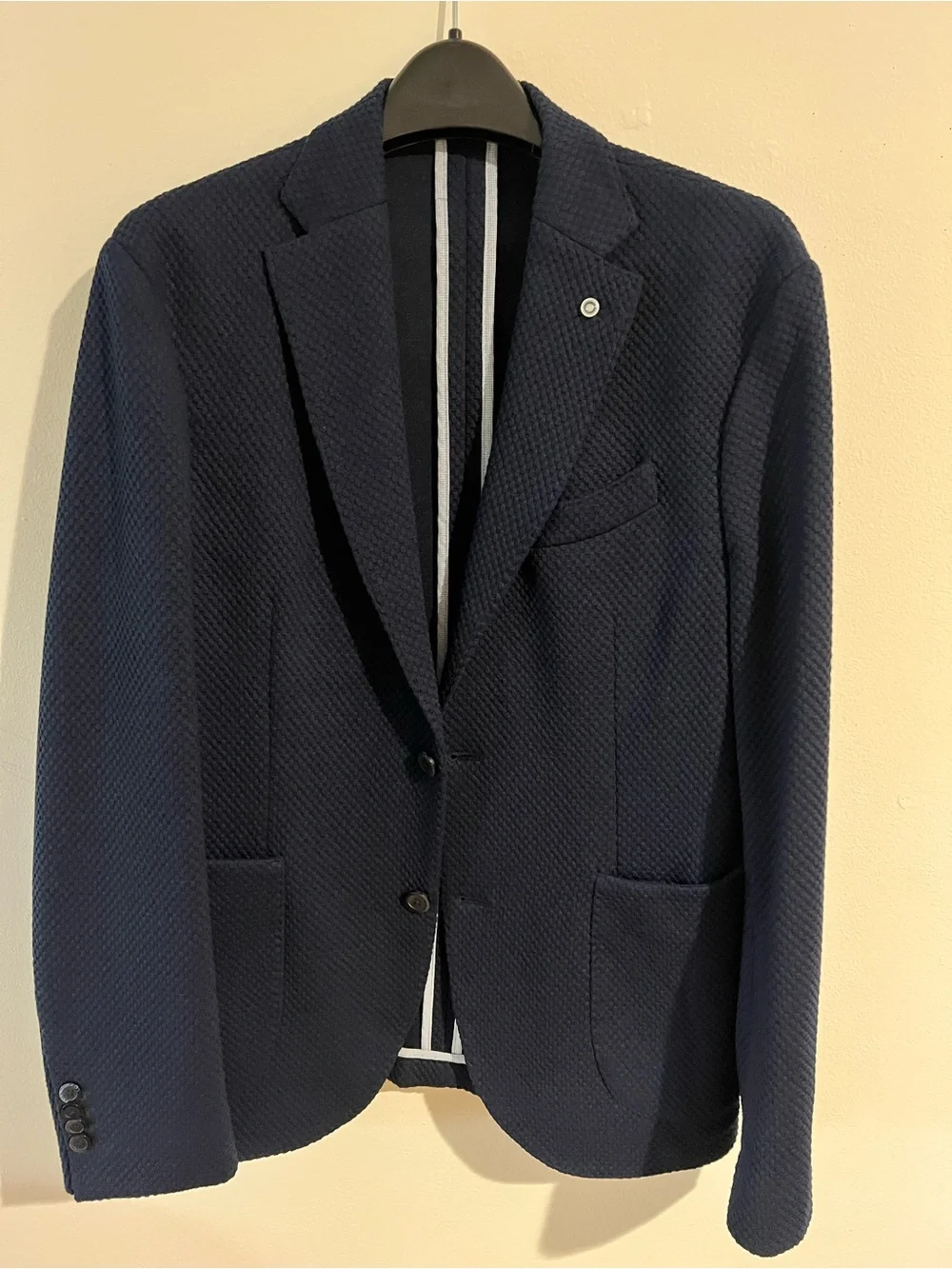 MANGO Man navy blazer features a textured microstructure fabric